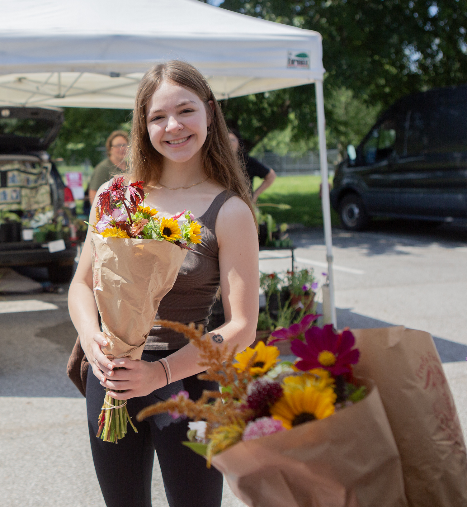 A happy customer at the Fred's Flowers stall